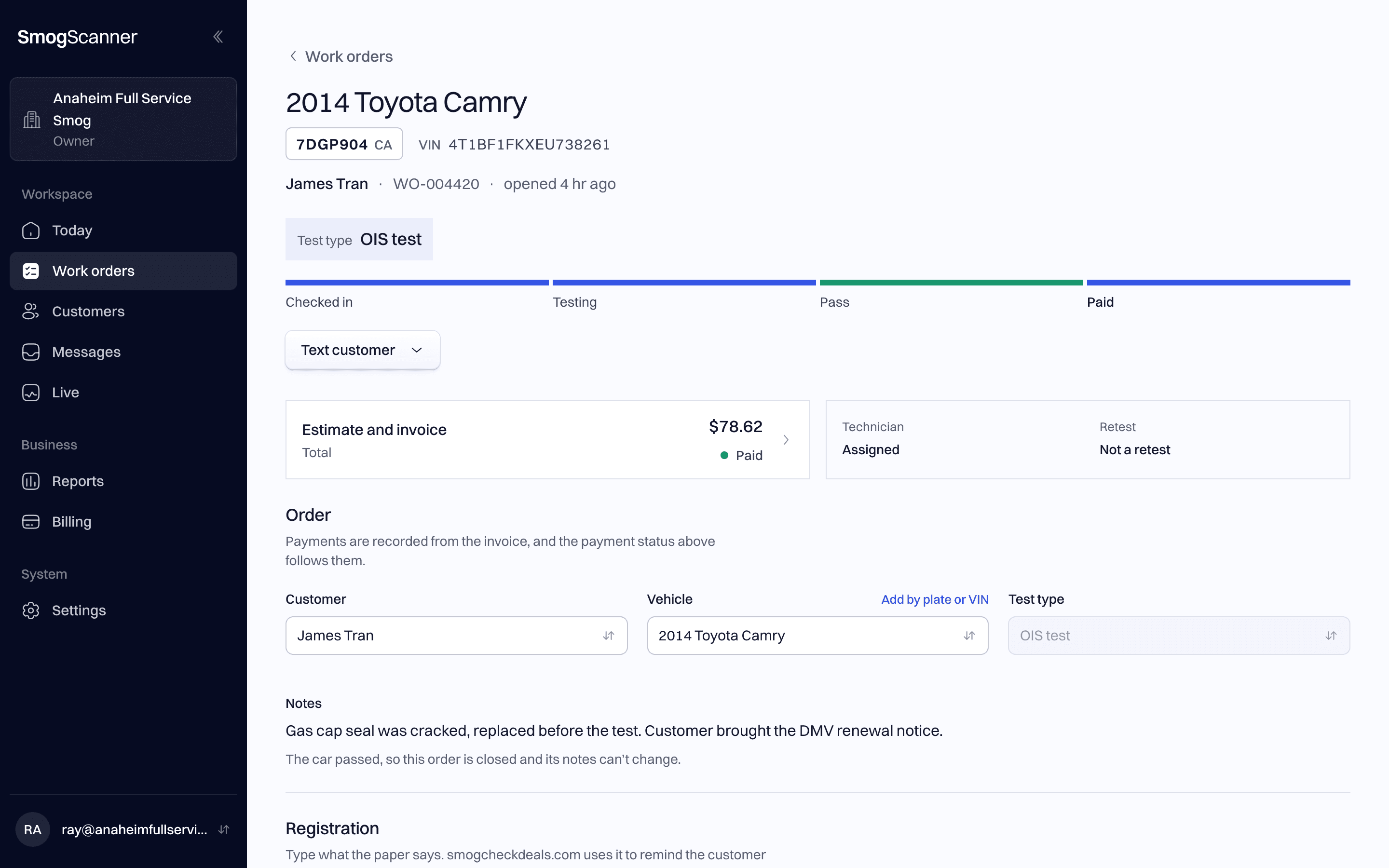 The work order for a 2014 Toyota Camry on a computer: OIS test, passed and paid.