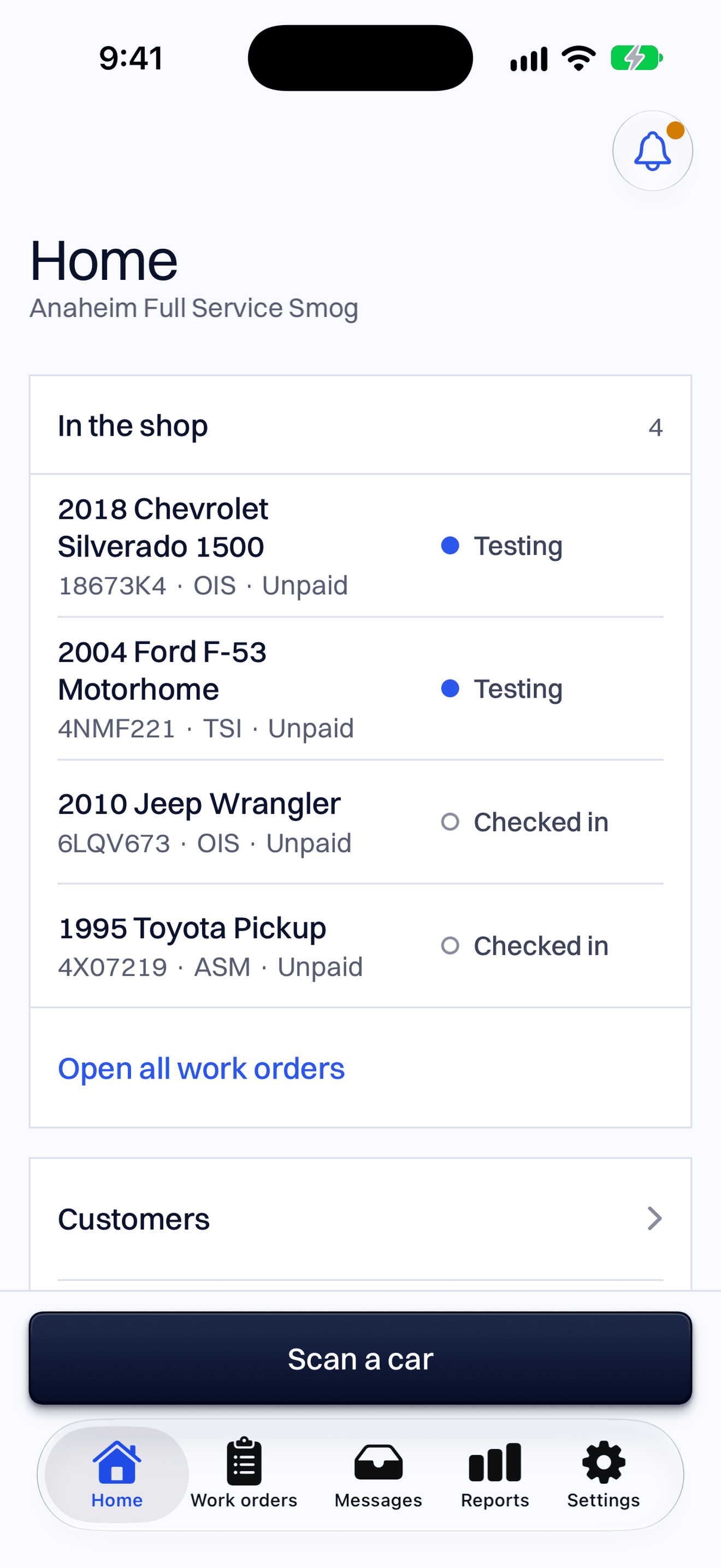 The phone app’s Home screen: the cars in the shop with their status, and the big Scan a car button.