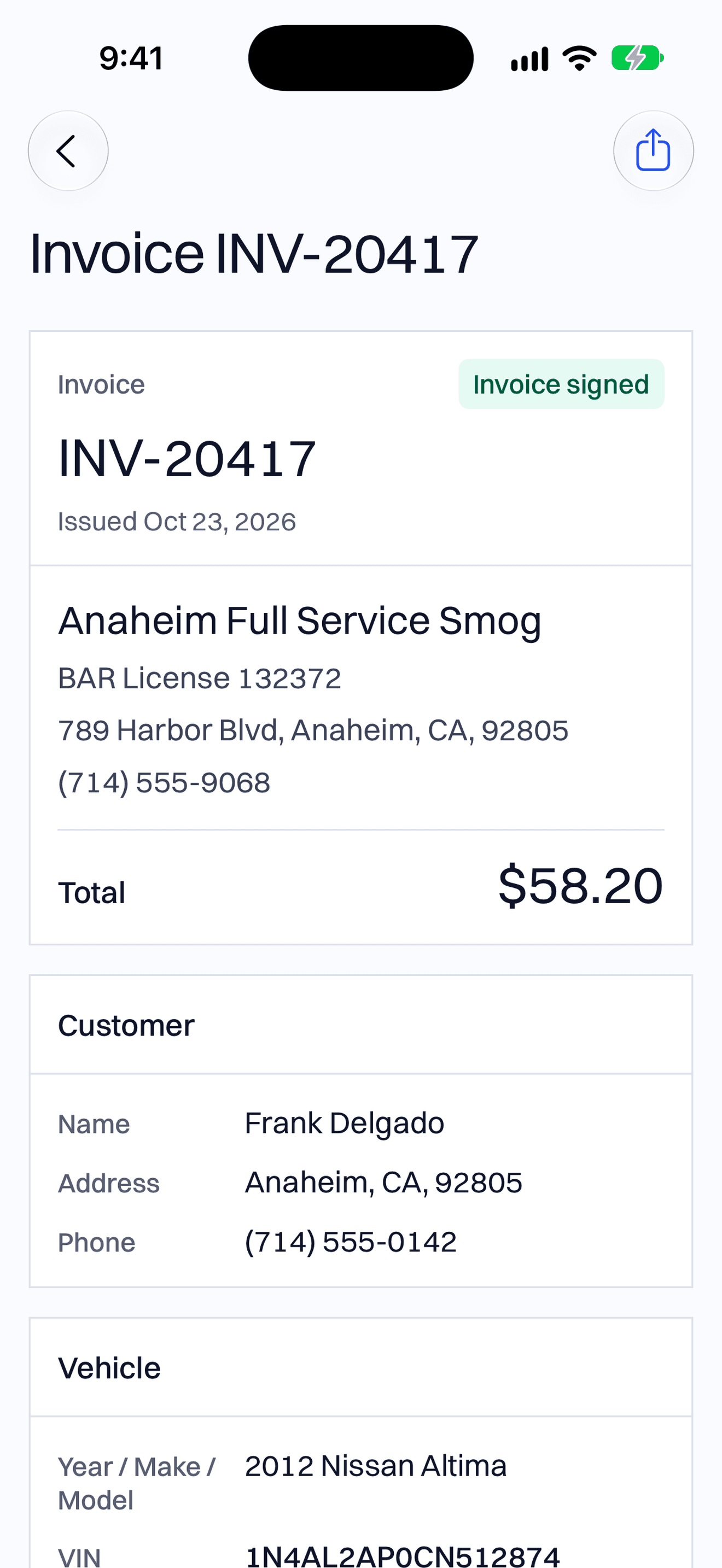 An invoice for $58.20 with the station, the customer and the car on it.